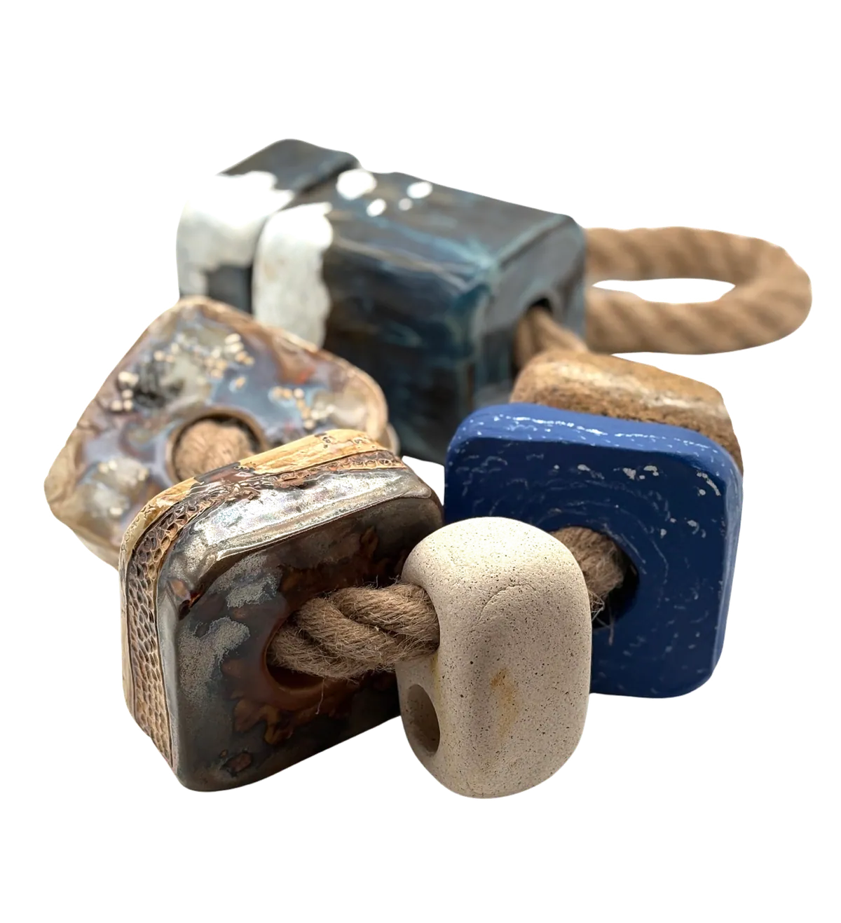 Bluff/Spit/Drift: glazed stoneware blocks and a raw clay bead strung on thick natural rope.