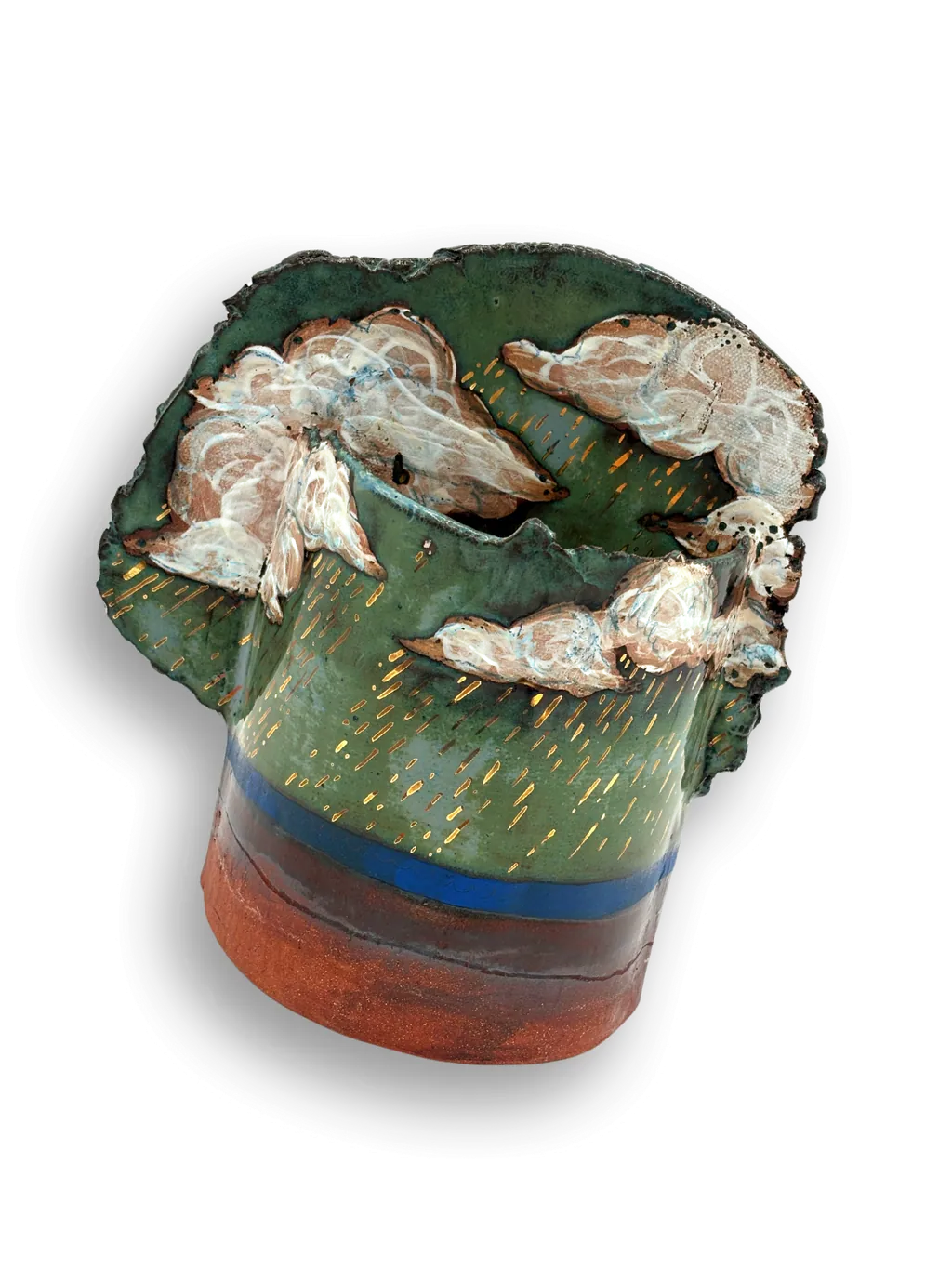 A carved stoneware block glazed in bright green with a red rim and drips of white slip.